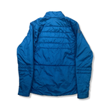 Back view of a blue Scott hybrid jacket against a white background.