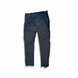 Black Peak Performance M Scale Softshell men's softshell pants, back view against a white background.