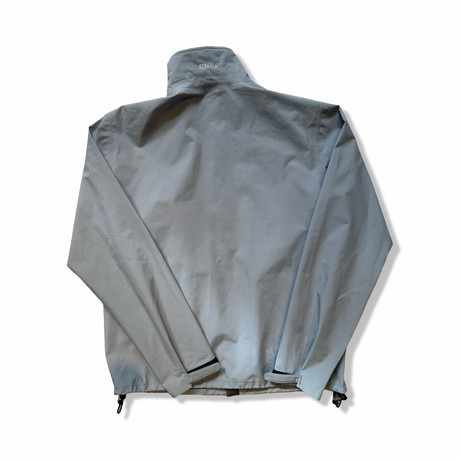 Grey Peak Performance men's shell jacket with Gore-Tex detail on the back collar, back view against a white background.