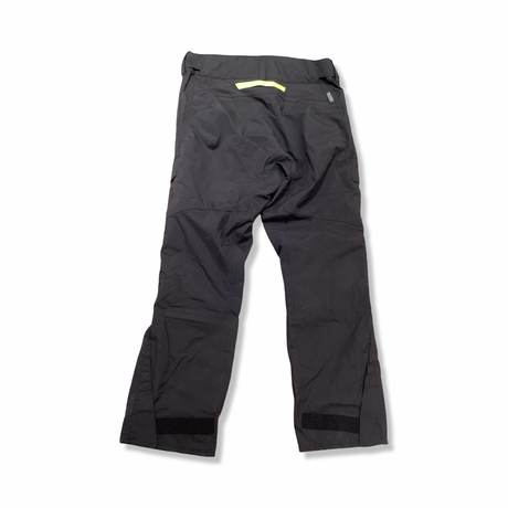 Back view of a grey Helly Hansen men's sailing trousers against a white background.