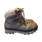 Brown Meindl women's hiking boots with lacing and a patterned sole, photographed from the side against a white background.