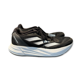 Black and white Adidas women's running shoe in model Duramospeed Lightstrike, photographed from the side against a white background.