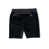 Back view of black wool base layer shorts from Varg with an elastic waistband against a white background.