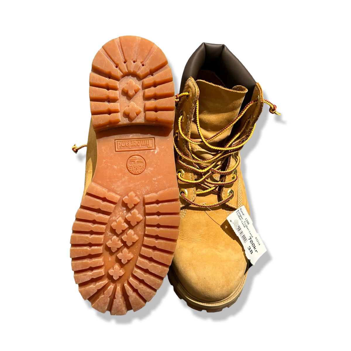 A pair of brown Timberland women's boots in size 38, shown with a sole facing upwards against a white background.