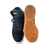 Black Adidas Frozetic boots viewed from above with one shoe upside down to show the brown rubber sole, against a white background.