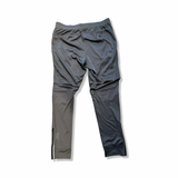 Grey and black ON Weather Pants men's performance pants, back view against a white background.