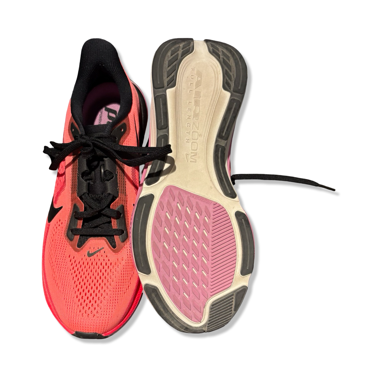 Orange and black unisex Nike Air Zoom Pegasus 42 running shoes with visible sole, photographed from the front and underneath against a white background.