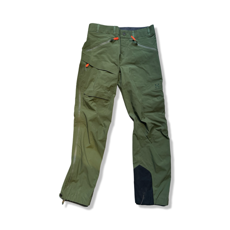 Green Haglöfs Evo Grym unisex shell pants, front view against a white background.