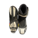 White and black Salomon men's pro combi boots, shown from above and below against a white background.