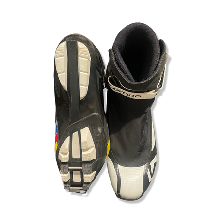 White and black Salomon men's pro combi boots, shown from above and below against a white background.