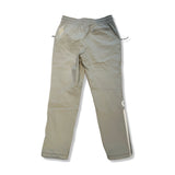 Baksidan av ett par beige funktionsbyxor ON Track Pants IKON för herr med dragkedja bak, fotograferade mot en vit bakgrund.