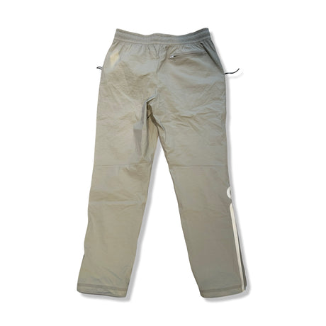 Beige ON men's Track Pants IKON, back view against a white background.