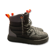 A pair of black Swims snow boots with orange details, side view against a white background.