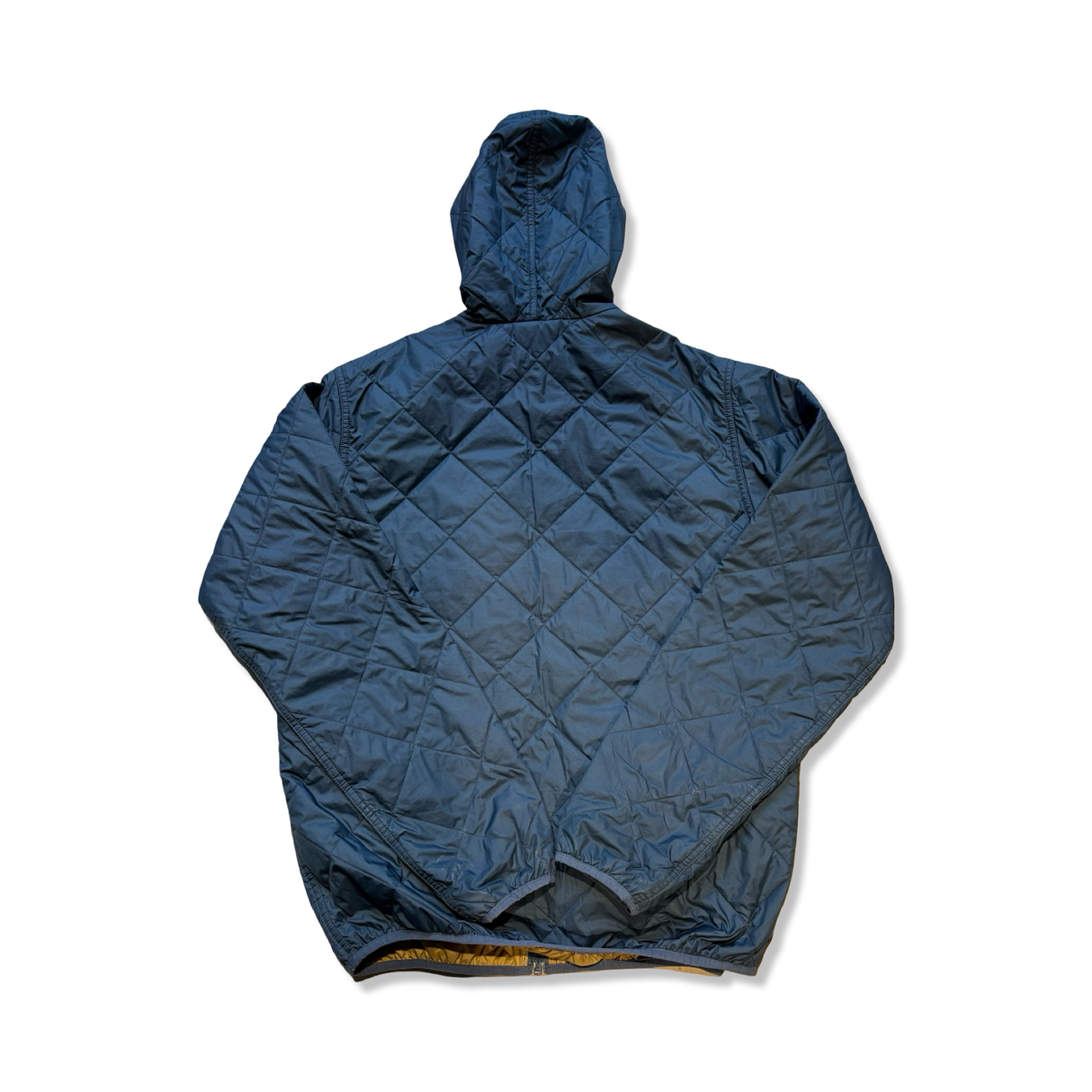 Back view of a blue Patagonia men's diamond quilted bomber hoody against a white background.