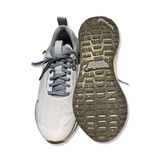 Grey unisex Nike Infinity 4 GTX running shoes with visible sole, photographed from the front and underneath against a white background.