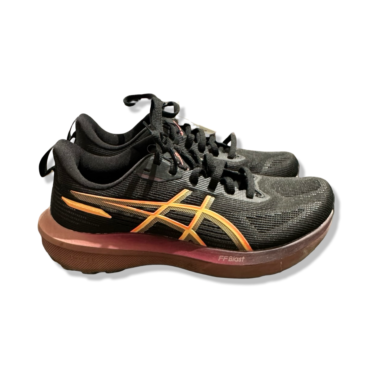 Black women's running shoes Asics GT-1000 14 with orange details, side view against a white background.
