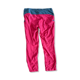Men's red Bergans Utte hiking pants with a blue waist, back view against a white background.