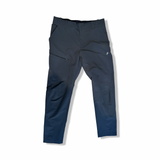 Black softshell functional pants from Peak Performance for men in size L, photographed from the front against a white background.