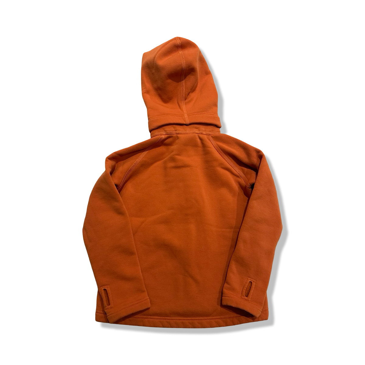 Baksidan av en orange Houdini Power Houdi fleececardigan för barn, fotograferad mot en vit bakgrund.
