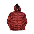 Maroon Haglöfs women's down jacket with a hood, front view against a white background.