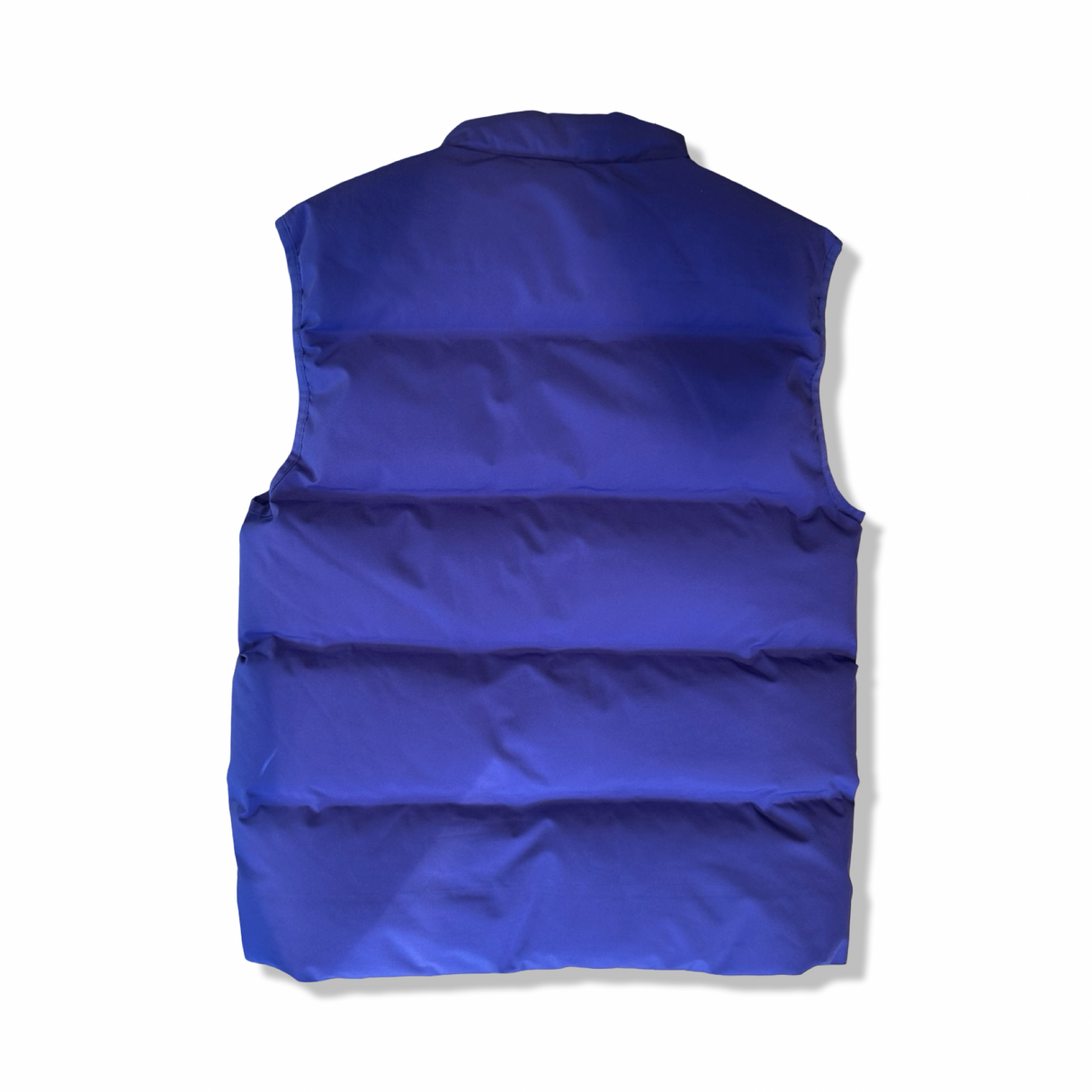 Back view of a purple Holzweiler men's vest, photographed flat against a white background.