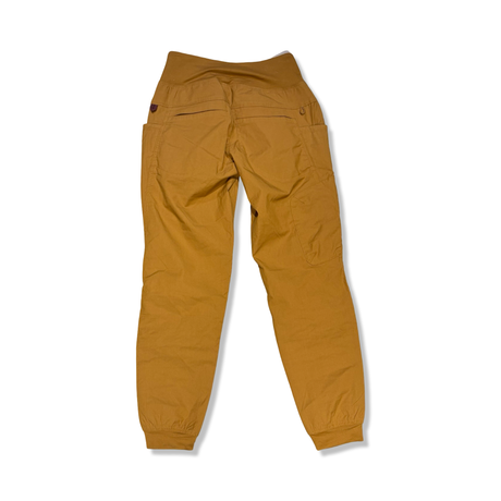Mustard yellow Prana Kanab women's functional pants, rear view against a white background.
