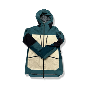 Blue and white Peak Performance women's hooded shell jacket with zipper, front view.