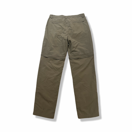 Back view of a green Craghoppers women's functional trousers against a white background.