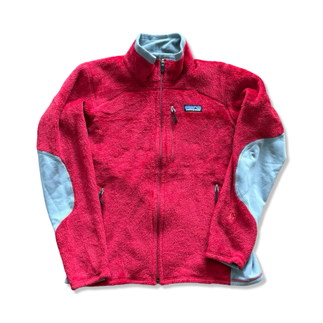 Red Patagonia fleece cardigan with zipper and grey details on a white background.