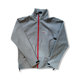 Grey Peak Performance men's Golf GTU shell jacket with a red zipper, front view against a white background.