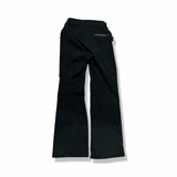 Black Peak Performance women's Alpine Gore-Tex shell pants, back view against a white background.