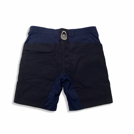Back view of blue Sail Racing men's sailing shorts against a white background.