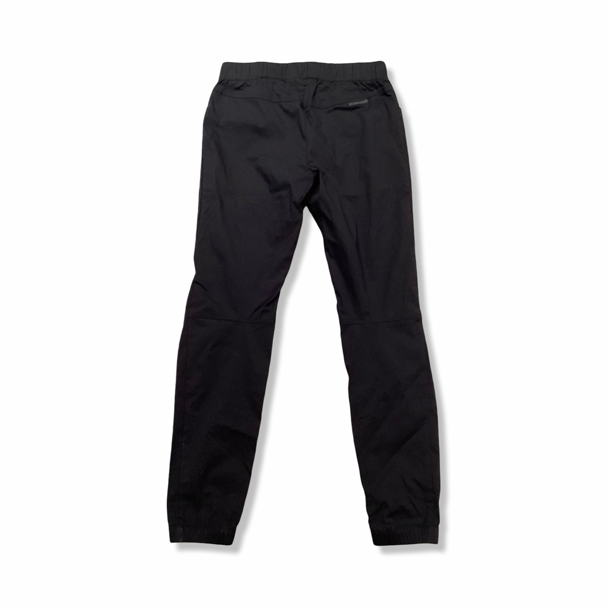 Black Ortovox women's pants, back view against a white background.