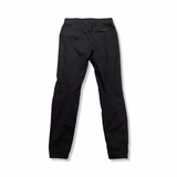 Black Ortovox women's pants, back view against a white background.