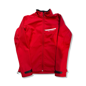 Red Helly Hansen women's softshell jacket with a zipper, front view against a white background.