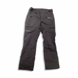 Grey Helly Hansen men's sailing trousers with zippered pockets, front view against a white background.