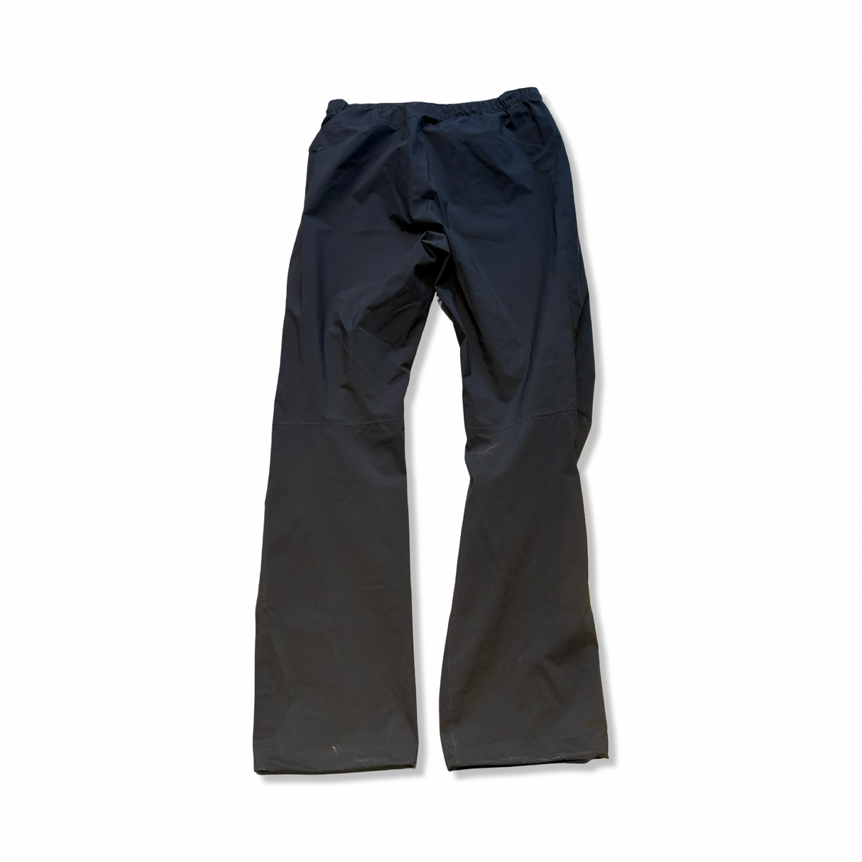 Black Peak Performance women's rain pants in size S, back view against a white background.