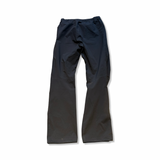 Black Peak Performance women's rain pants in size S, back view against a white background.