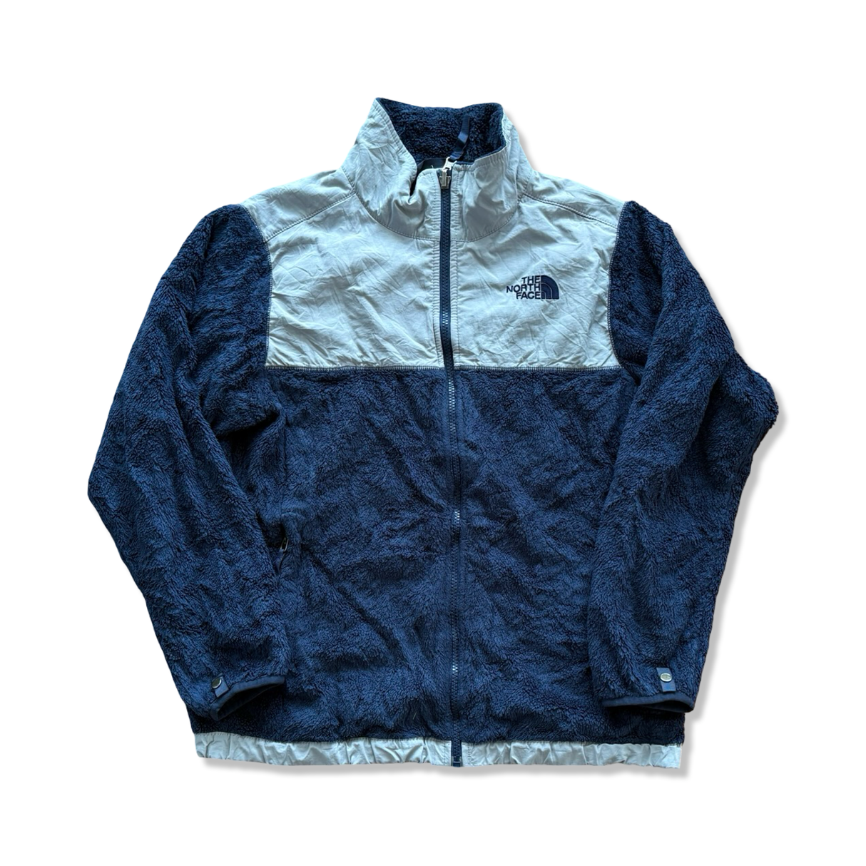 Blue and light grey The North Face women's fleece cardigan with a zipper, front view against a white background.