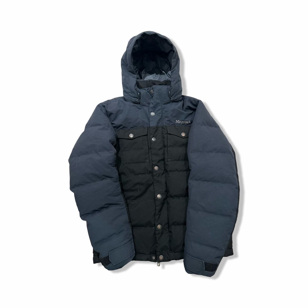 Black Marmot women's down jacket with hood and chest pockets, front view against a white background.