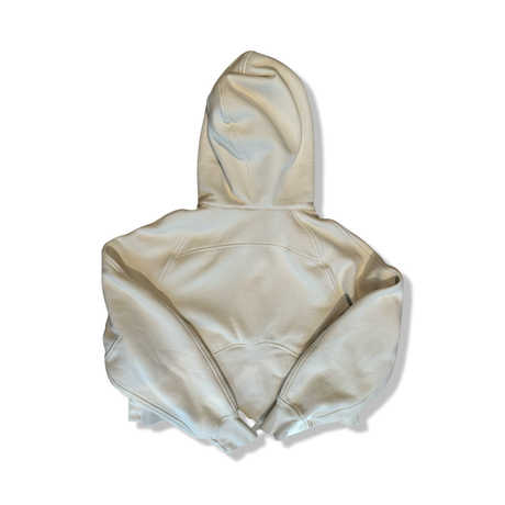 Offwhite hoodie från Lululemon i dammodell storlek XS, fotograferad bakifrån mot en vit bakgrund.