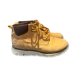 Brown Timberland women's boots, photographed from the side against a white background.