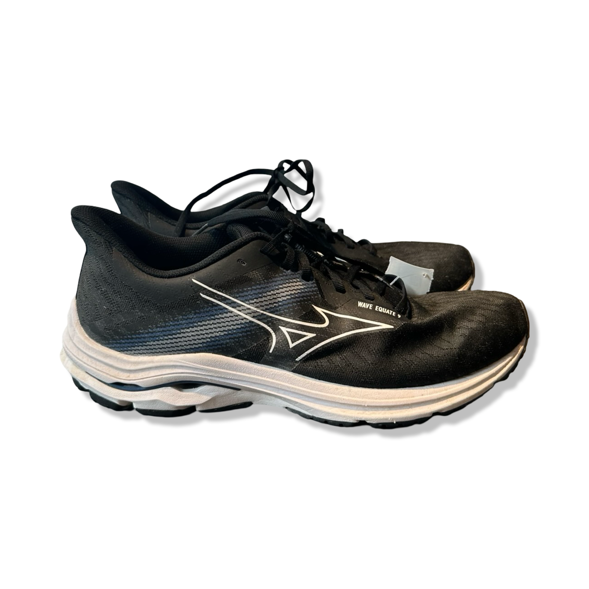 Black Mizuno running shoes with a white sole and logo, photographed from the side against a white background.