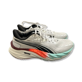 White Puma Velocity Nitro 4 HYROX women's running shoes with black details, side view against a white background.