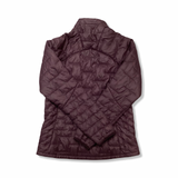 Back view of a purple Patagonia Nano Puff women's synthetic jacket against a white background.