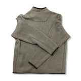 Back view of a beige Arc'teryx men's fleece cardigan against a white background.