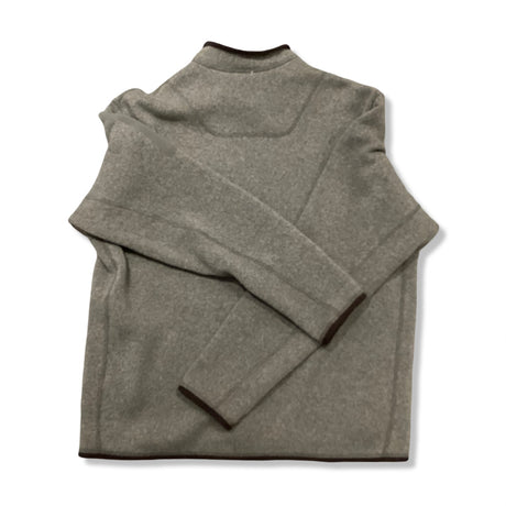 Baksidan av en beige fleececardigan från Arc'teryx för herr, fotograferad mot en vit bakgrund.