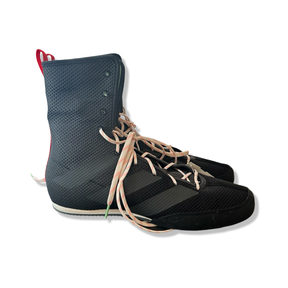 Black Adidas men's high-top boxing shoes with light-colored laces, photographed from the side against a white background.