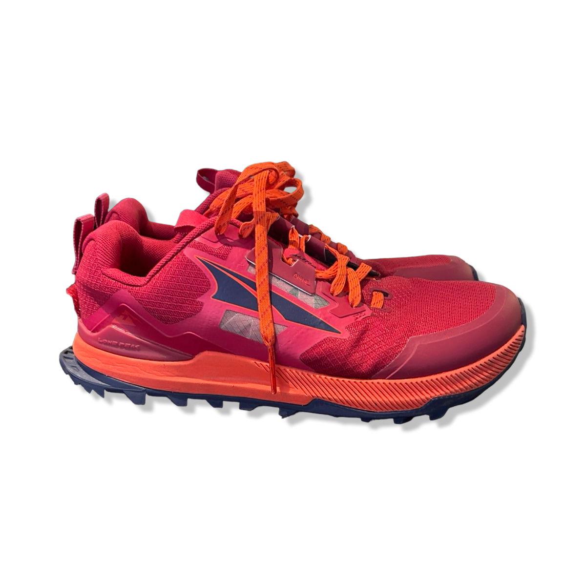 Pink Altra Lone Peak 7 women's hiking shoes, side view against a white background.