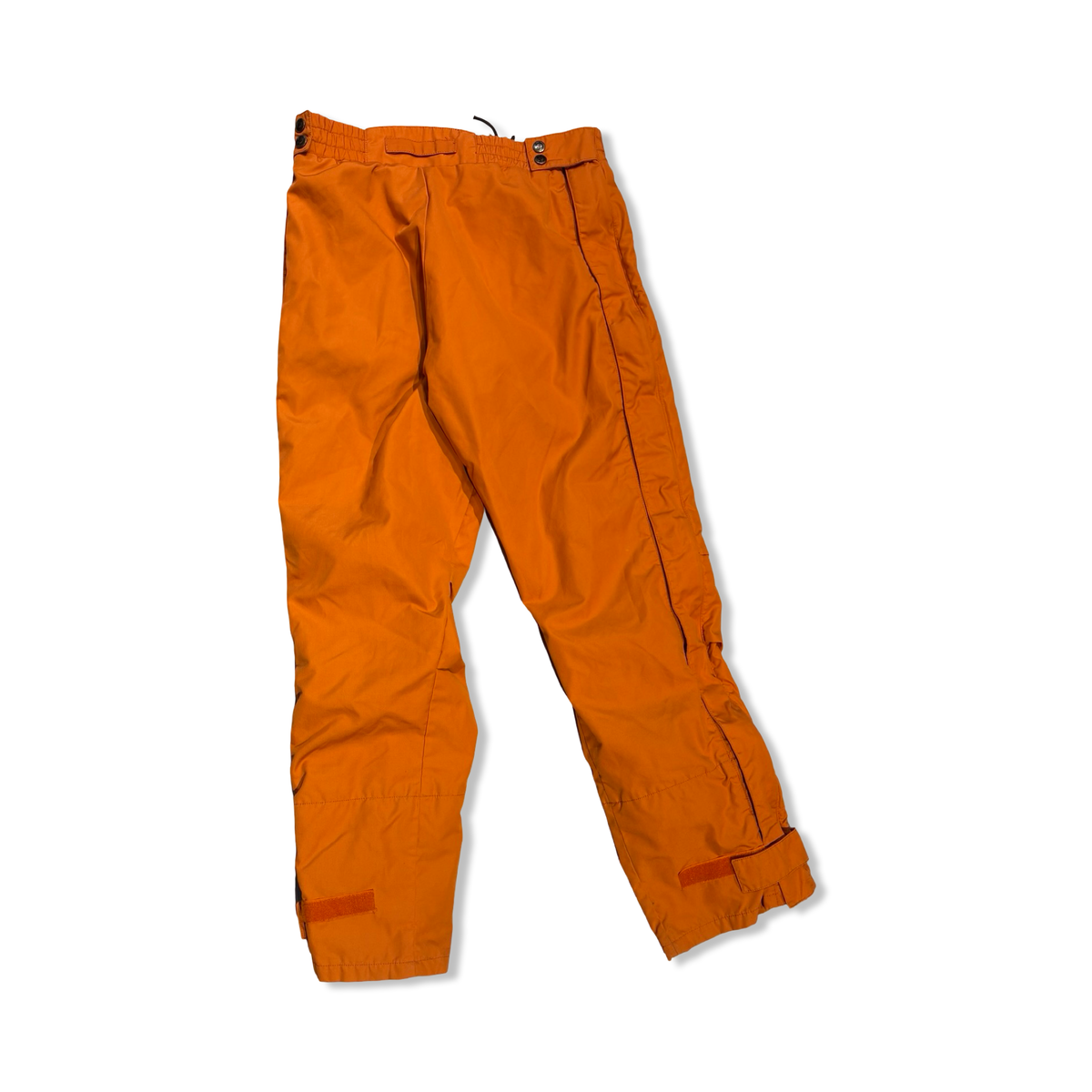 Back view of orange Fjällräven women's functional pants against a white background.